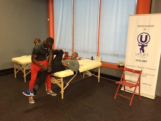 Dr. Mike Mensah works on a Crossfit athlete before 16.1 mobility work = injury prevention.