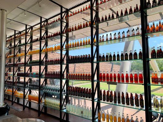 The walls decorated with soda bottles.