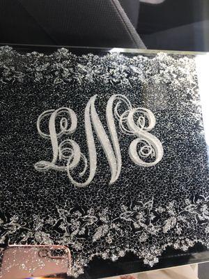 Interlocking monogram on mirrored jewelry box