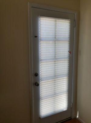 Pleated horizontal shades with Budget Blinds exclusive 'No Questions Asked' Warranty for a bedroom door.