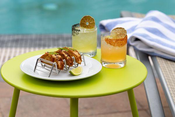 Tuna Poke Nachos and Fresh Cocktails served by the pool