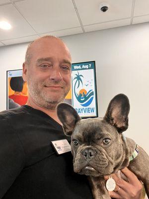 Jay Hospital Manager posing with clients pet