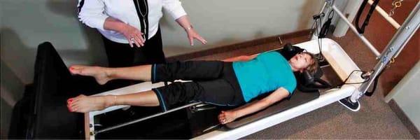 Using the Pilates Reformer.