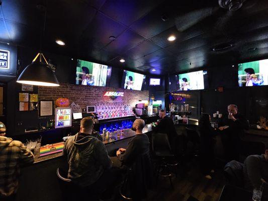 Bar area with a buncho tvs n alcohol.