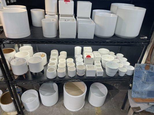 White pots in different shapes and sizes