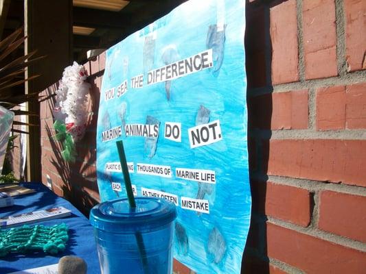 Sign posted at Rise Above Plastics free shopping bag giveaway in Pacific Beach.