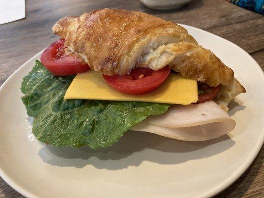 Turkey bacon cheese on a fresh made croissant.