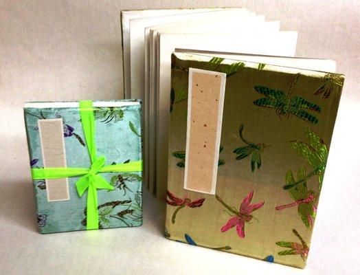 This book folded into 24 papes like accordion. All paper are handmade with Chinese Xuan paper. It is bound with a silk embroidered cover