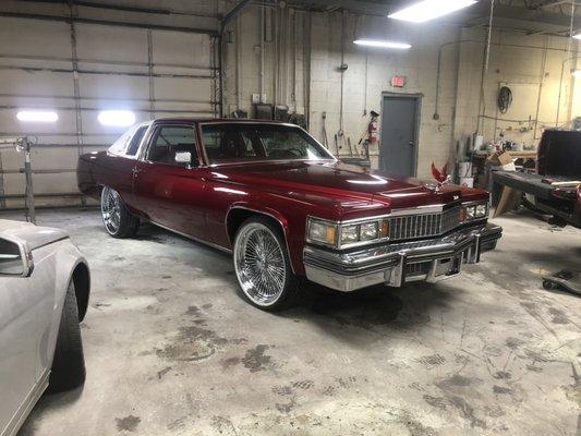 Cadillac deville candy apple red paint job and brand new 22" wire wheels