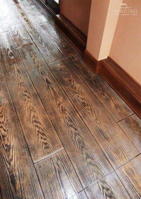 We can simulate hardwood floors with stamped and stained concrete for a fraction of the cost and much less maintenance!