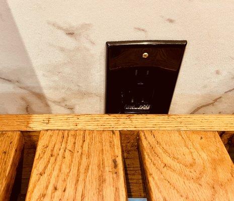 A wall outlet to charge up your phone. Not every booth has one.