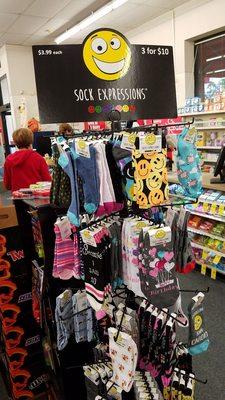 Cool socks on sale at checkout counter area.