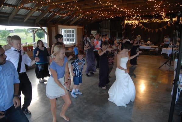 In a barn open to a peach orchard.