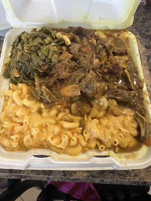 Curry Goat, Mac and Cheese,  and greens.