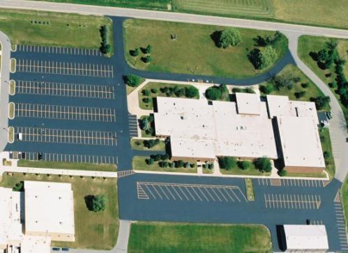 A large parking lot we sealed , striped and numbered stalls