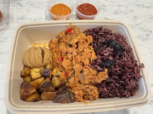 Custom bowl - purple rice, spicy pork, roasted potatoes, soy marinated egg.