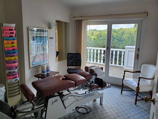 Treatment room with a view of Canopus island on lake Mahopac New York.