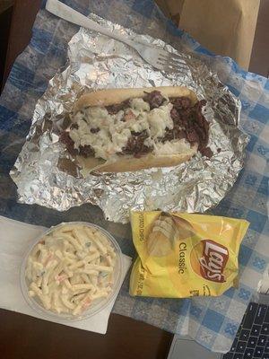 Pastrami cheese steak half sandwich and macaroni salad