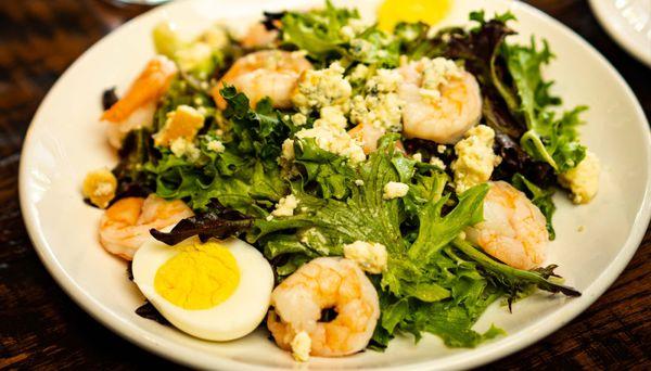 SHRIMP BAY
 Gulf shrimp, smoked Moody Bleu cheese, hard-boiled egg, mixed local greens, Greek vinaigrette