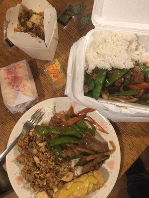 Chicken fried rice, egg rolls and beef with broccoli and carrots.