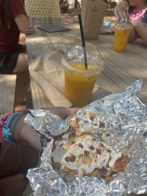 Mango smoothie and chocolate chip scone.