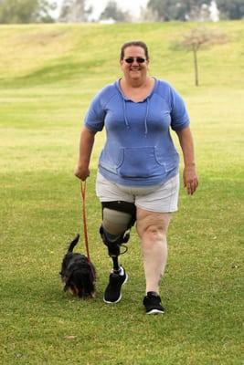 Kim getting out with her pup for a walk in the park.