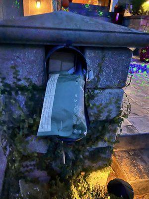 Mail sticking out of open mailbox because it doesn't fit.