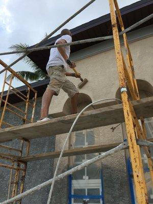 Back rolling the exterior of a Brand New home