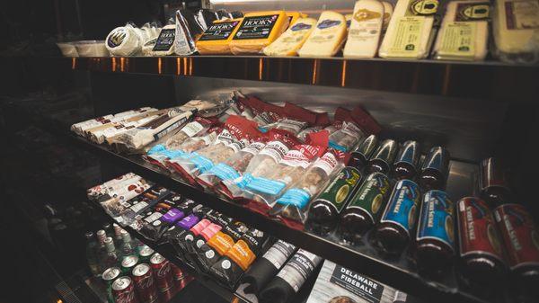 A variety of retail cheese and charcuterie.