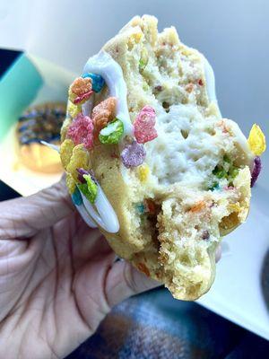 Fruity pebbles cookie filled with cream cheese frosting