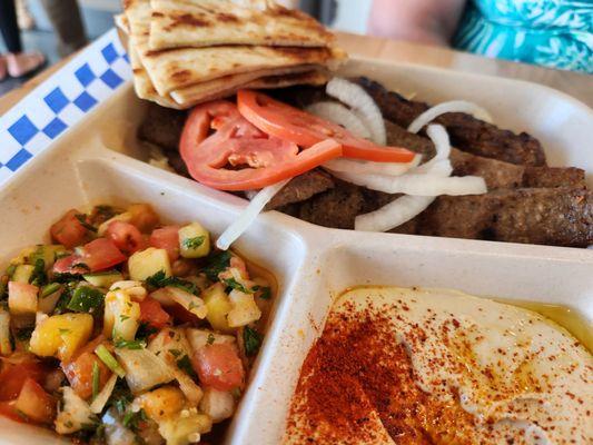 Kafta, gyro,  Israeli salad, very smooth hummas plus rice.  Enough to hold us over till dinner.