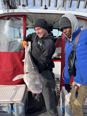 Me and boy on a Slot size sturgeon