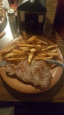 Juicy ribeye steak and crispy fries.