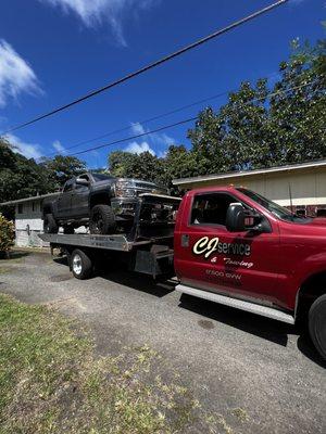 Lifted Silverado on CJ's tow truck.