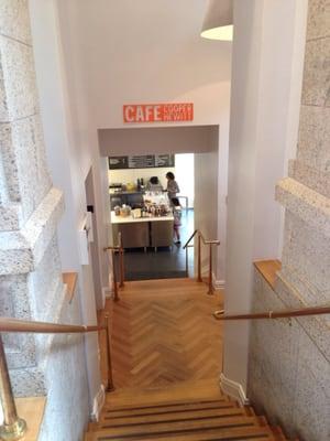 Cafe is downstairs next to the restrooms.