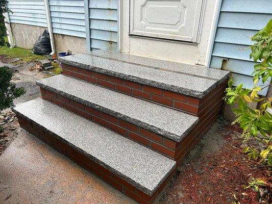 New step system with granite finishers