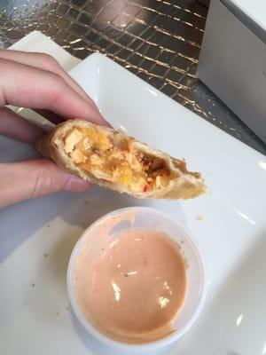 Chicken and cheese empanada with a side of delicious  pink sauce  !