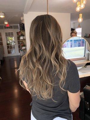 Soft balayage and subtle layering.