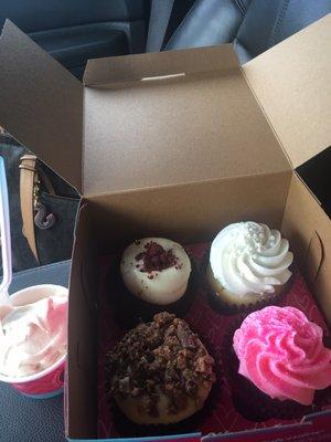 Red velvet, wedding cake, chocolate, and peanut butter crunch cupcakes.