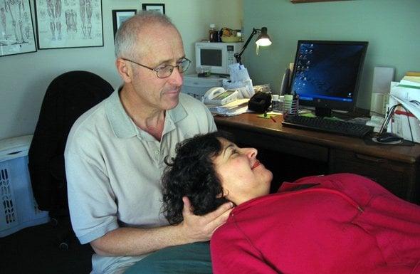 Gadi Kaufman treating a patient