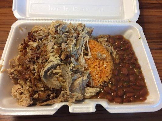 Pork shoulder with yellow rice and beans