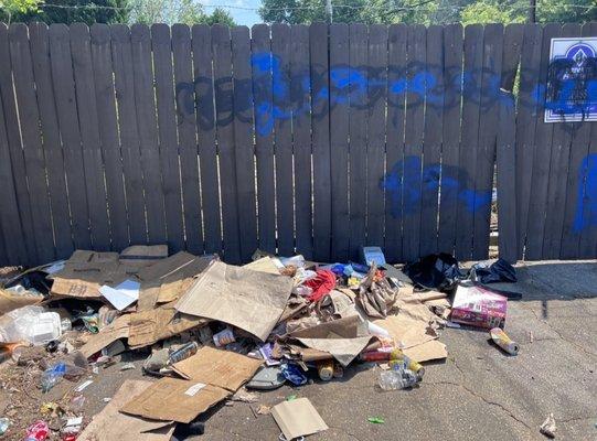 Trash left from homeless people and prostitutes who live directly outside the complex.