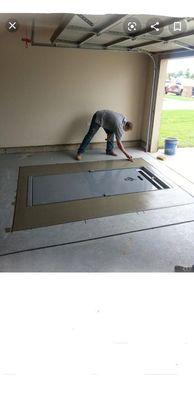 This storm shelter was installed under the garage floor.