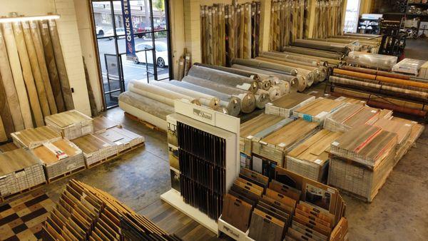 Warehouse stocked with carpet and luxury vinyl plank.