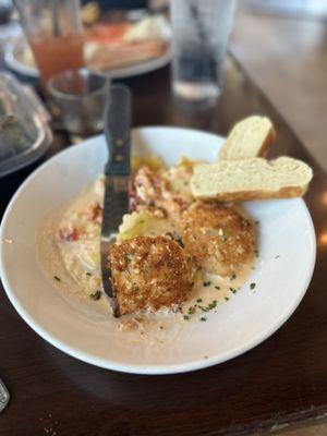 Lobster ravioli, with lobster cream sauce, and almond crusted salmon.