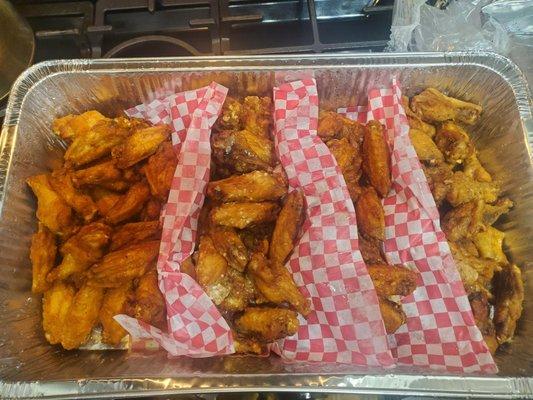 100 tray of wings - flavors left to right are mild, garlic parm, Thai chili, honey lemon pepper