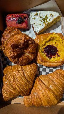 Blackberry olive oil cake, pistachio cornbread, kouign amann, creamed corn tile with blueberry miso jam, plain croissant