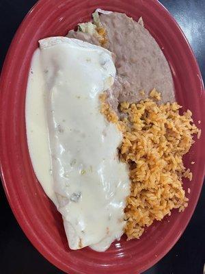 Bean burrito, smothered in white cheese, beans, and rice