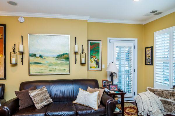 The warm golden walls are a wonderful back drop for the wonderful furniture and furnishings.