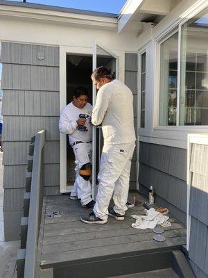 Installing a new security kitchen screen door.